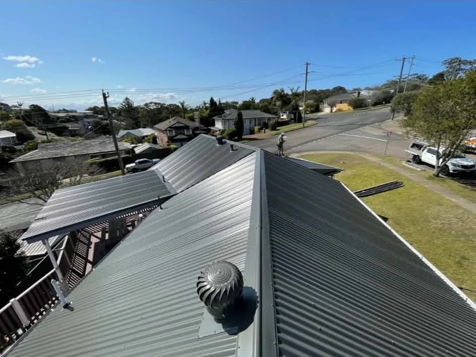 Whirlybird on a dark Colorbond corrugated roof