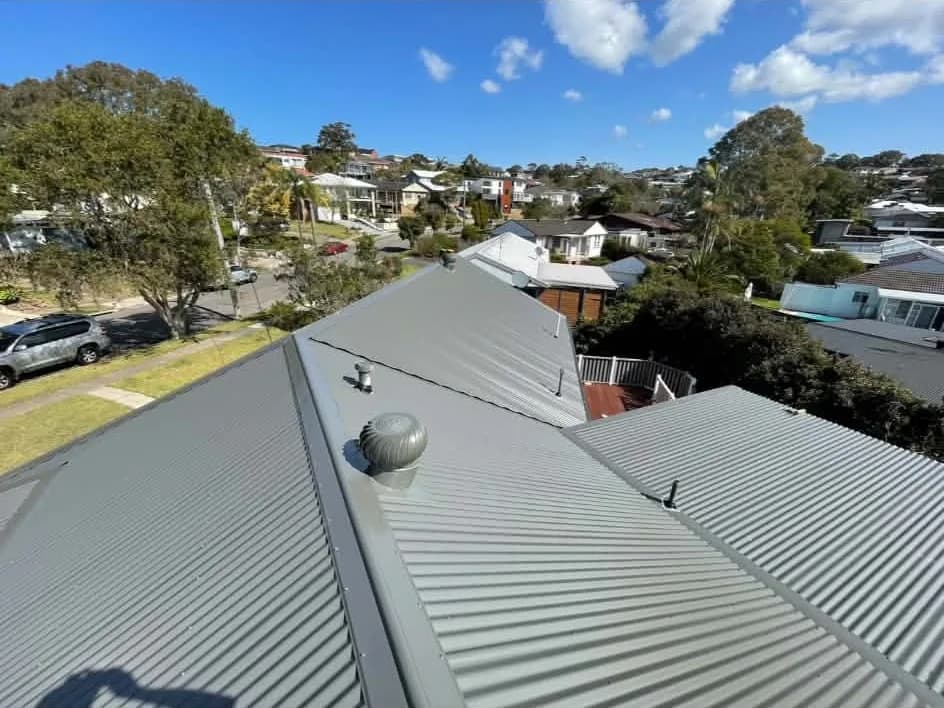 Grey Colorbond corrugated roof with a whirlybird