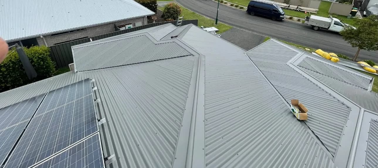 New Colorbond roof with solar panels and multiple hips